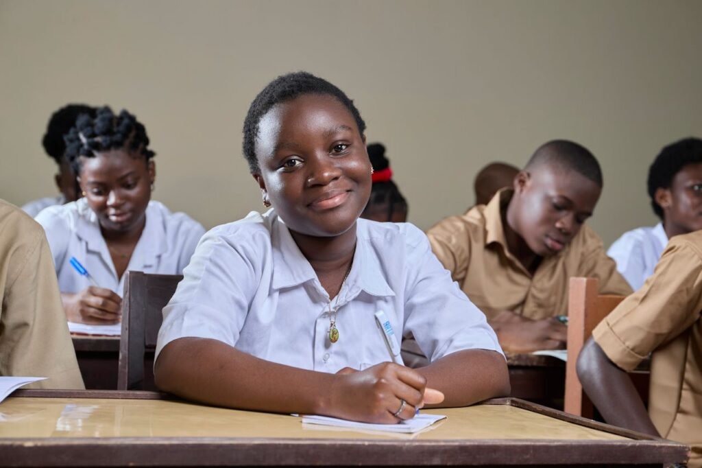 Engaged students studying in a diverse classroom environment, showcasing educational commitment.