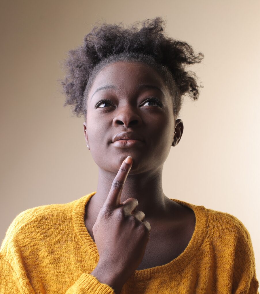 african american female thinking with her finger on her chin